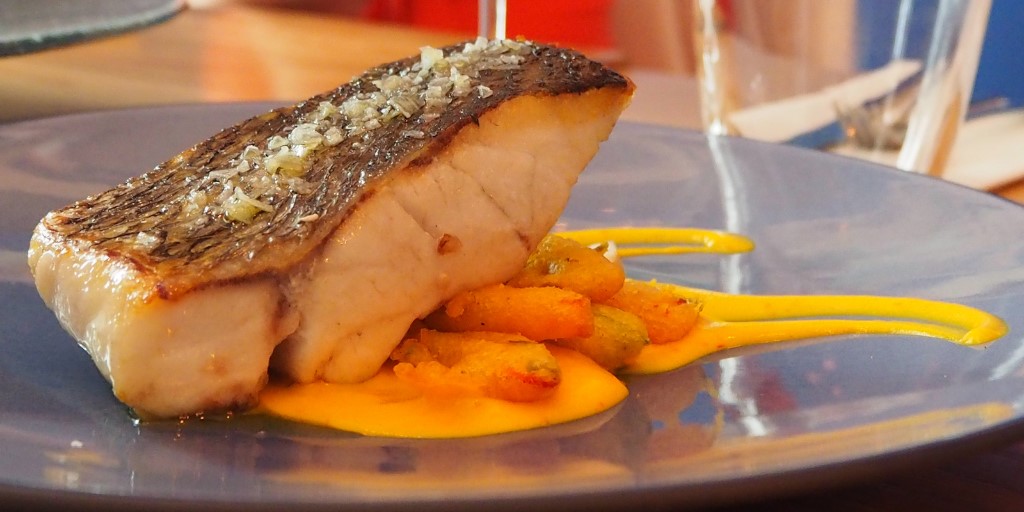 Caramelised cod on plate at one of the best places to eat in Malaga